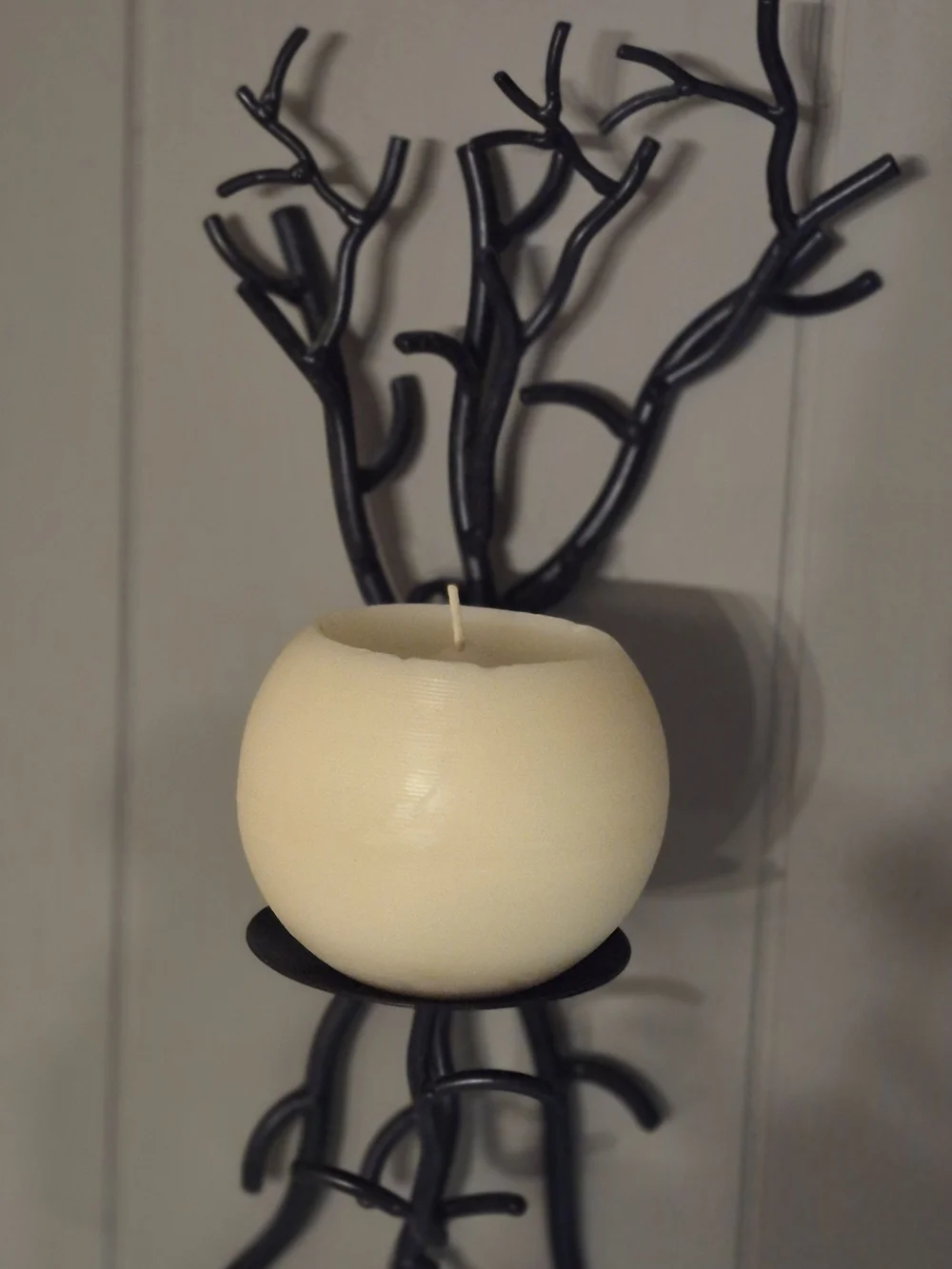 Wall-Mounted Brown Metal Branch Sconce with Cream Candle Holder. Its 17